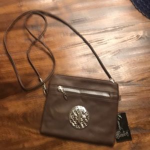 Brown leather crossbody! Great for travel.